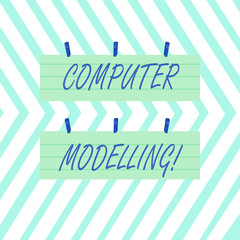 Word writing text Computer Modelling. Business photo showcasing using a computer to make a model of a plan or design Two Color Blank Strip Size Lined Paper Sheet Hanging Using Blue Clothespin