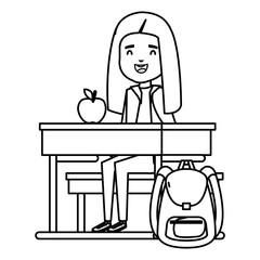 student girl seated in school desk with apple and bag