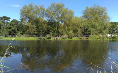Fototapeta na wymiar River Liffey in Dublin, Ireland at Memorial Park on a beautiful sunny day in summer