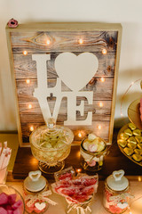 Candy bar beautifully decorated with sweets in a vintage event.