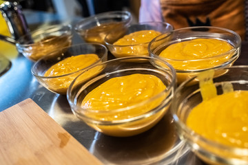 Cook plating their dishes and serving them hot and tasty.