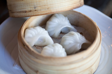 fresh steamed dumplings in a basket