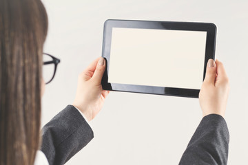 Woman hand holding empty tablet