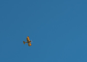 Biplane Flies Over with Copy Space