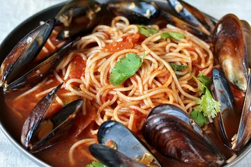 Pasta Spaghetti with mussels, tomato sauce. sea food meal. Mussels Marinara. Typical dish of Italian pasta.