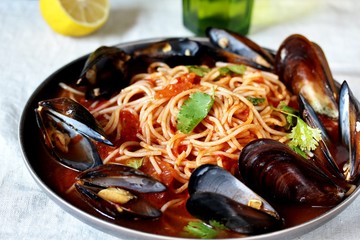 Pasta Spaghetti with mussels, tomato sauce. sea food meal. Mussels Marinara. Typical dish of Italian pasta.