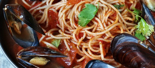 Pasta Spaghetti with mussels, tomato sauce. sea food meal. Mussels Marinara. Typical dish of Italian pasta.