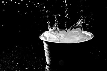 Ice water splashing on black background