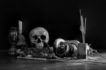 Skull with old altar table which has black background