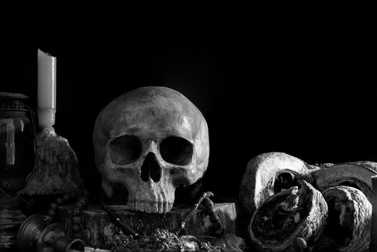 Skull with old altar table which has black background