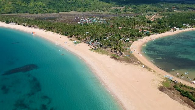 aerial reveal of double beach. Nacpan beach, El Nido , Palawan, Philippines