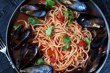 Pasta Spaghetti with mussels Marinara, tomato sauce. sea food meal. Typical dish of Italian pasta.  top view.