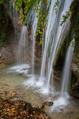 Fototapeta na wymiar Beautiful waterfall in the forest. Waterfall mountain close up