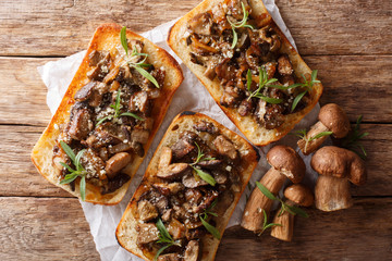 Italian homemade sandwiches with fried boletus mushrooms, onions, thyme and parmesan cheese...