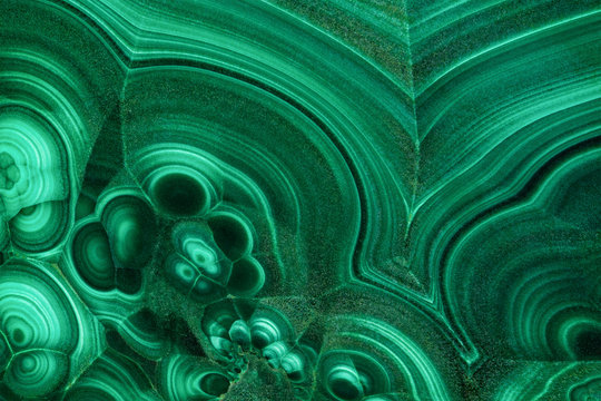 The green malachite. An ornamental stone. Photo texture. Macro.