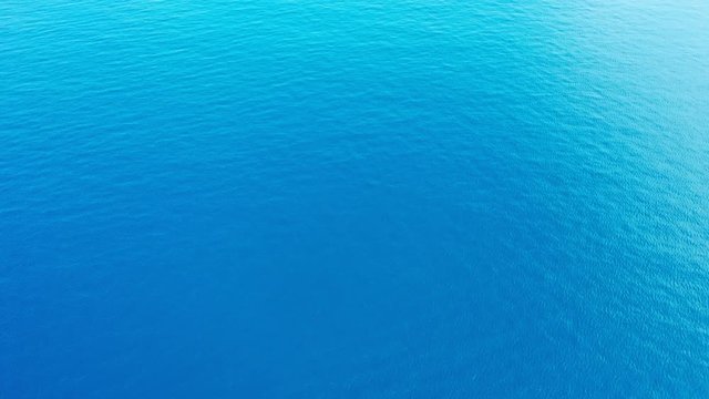 wide huge transparent crystal clean ocean blue water near tropics aerial drone footage maldives