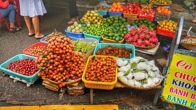 Salesperson is selling fruits, jam, street food and gifts in DaLat market