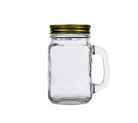 Glass jar with golden close cap isolated on white background.