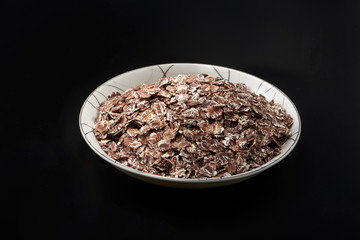 Close-up of a full plate of black oatmeal