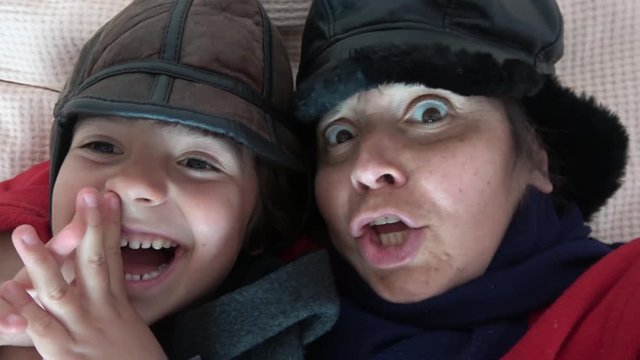 4K Selfie mother and child in winter clothes showing how cold it is in their bedroom