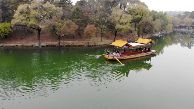 Aerial view of old Chinese boat on the lake inside the Imperial Summer Palace of The Mountain Resort (UNESCO World Heritage). Chengde. China. Chinese ancient old style boat