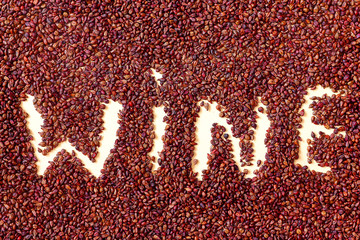 The inscription "wine" made from grape seed