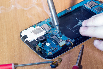 repair of a smartphone, replacement of a SIM card slot in a mobile phone