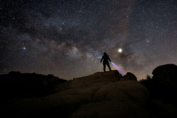 Person Light Painted in the Desert Under the Night Sky