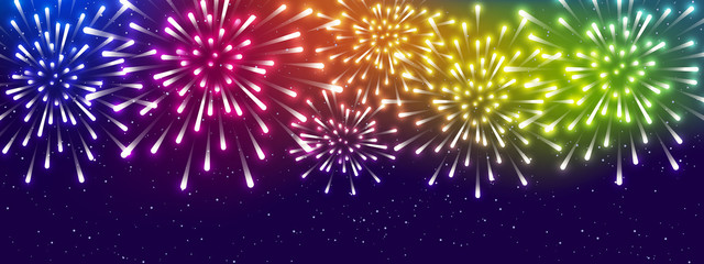Fototapeta na wymiar Shiny rainbow fireworks on starry sky background - horizontal panoramic banner for Your holiday design