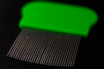 close-up on green loop comb
