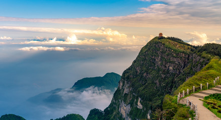Peaks and seas of clouds under blue sky and white clouds, Emei Mountain, Sichuan Province, China - obrazy, fototapety, plakaty