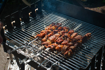 Grilled shashlik in the smoke. Cooking process