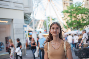 girl at the city attractions, urban area. portrait of a young girl in the city