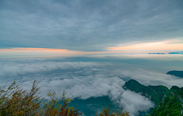 Fototapeta premium Mountains and seas of clouds at dusk, Emei Mountain, Sichuan Province, China