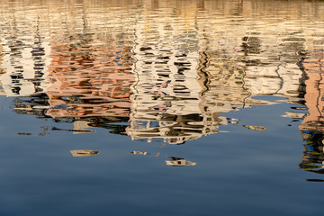 Reflection architecture city Udaipur in water lake at sunset. India, Rajasthan