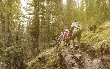 family climbing in mountains