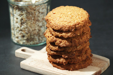 Homemade oatmeal cookie at dark background