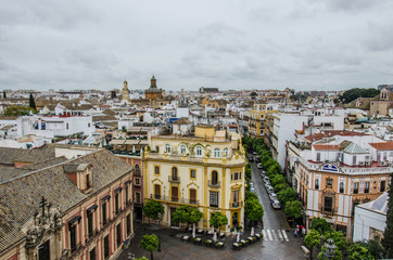 Fototapeta na wymiar Seville streets seen from a high vantage point, on a cloudy day