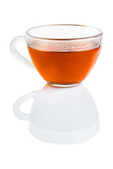 tea in transparent cup isolated on white with reflection