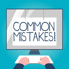 Text sign showing Common Mistakes. Business photo text repeat act or judgement misguided making something wrong Hands on Mockup Keyboard Front of Blank White Monitor with Screen Protector