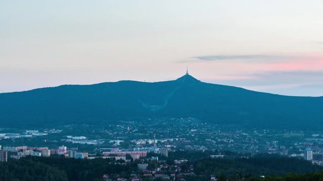 Timelapse of Liberec city with Jested in the evening, zoom view, Czech Republic