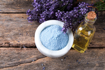 Obraz na płótnie Canvas spa massage setting, lavender product, oil on wooden background