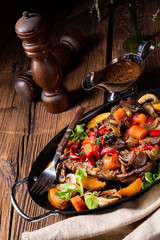 tender beef topped with various vegetables