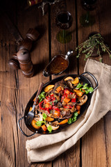 tender beef topped with various vegetables