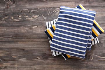 Stack of clothes on wooden background