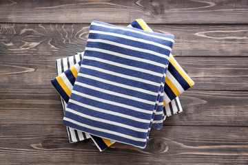 Stack of clothes on wooden background