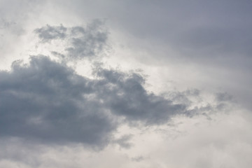 Naklejka na ściany i meble Gray, bizarre clouds in the cloudy weather_