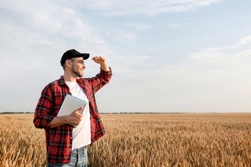 Farmer in field on sunny day