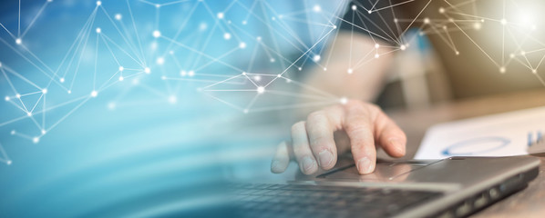 Man working on a laptop; multiple exposure