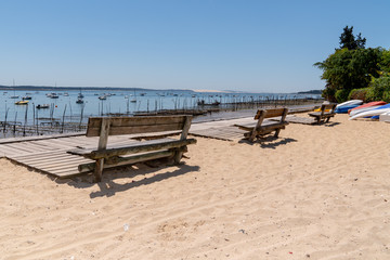 Fototapeta na wymiar Bench in Herbe village and oyster park in the Arcachon basin France